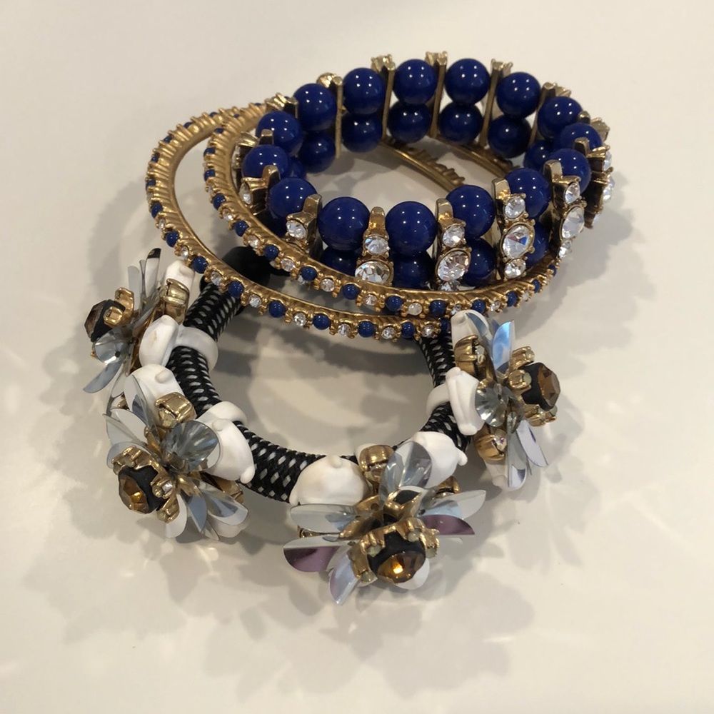 Four matching J.Crew blue and gold bracelets.